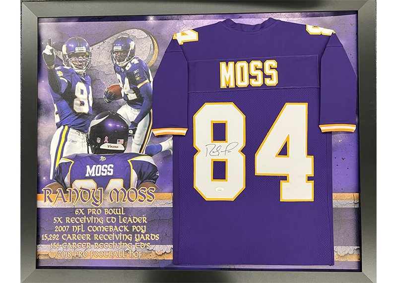 Randy Moss Autographed New England Blue frame jersey 35”x44” (JSA)