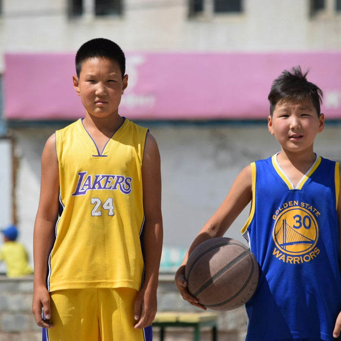 kids wearing basketball jerseys