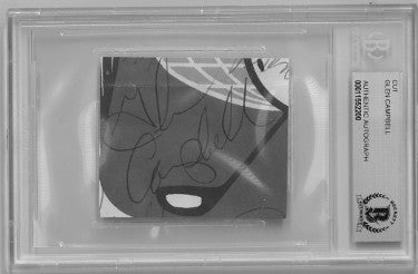 Glen Campbell signed 2"x2" Cut Signature- Beckett/BAS Encapsulation #00011552200 (Country Music Legend)