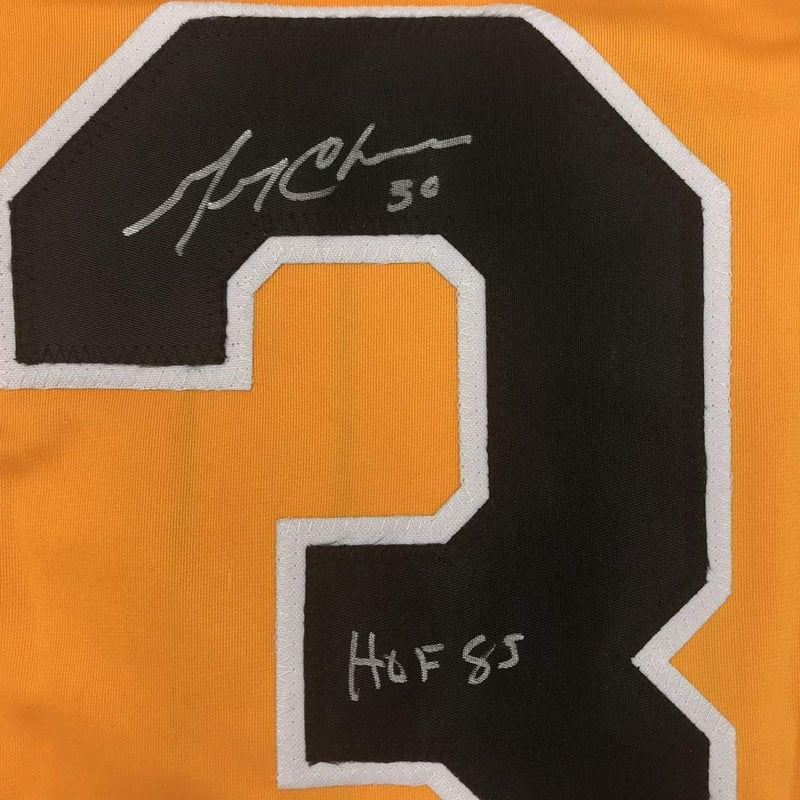 Framed Autographed/Signed Gerry Cheevers HOF 85 35x39 Boston Yellow Hockey Jersey JSA COA