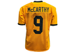 Yellow sports jersey with 'McCarthy' and number '9' on a white background