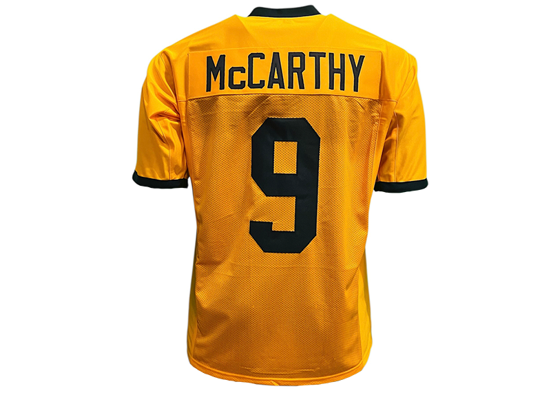 Yellow sports jersey with 'McCarthy' and number '9' on a white background