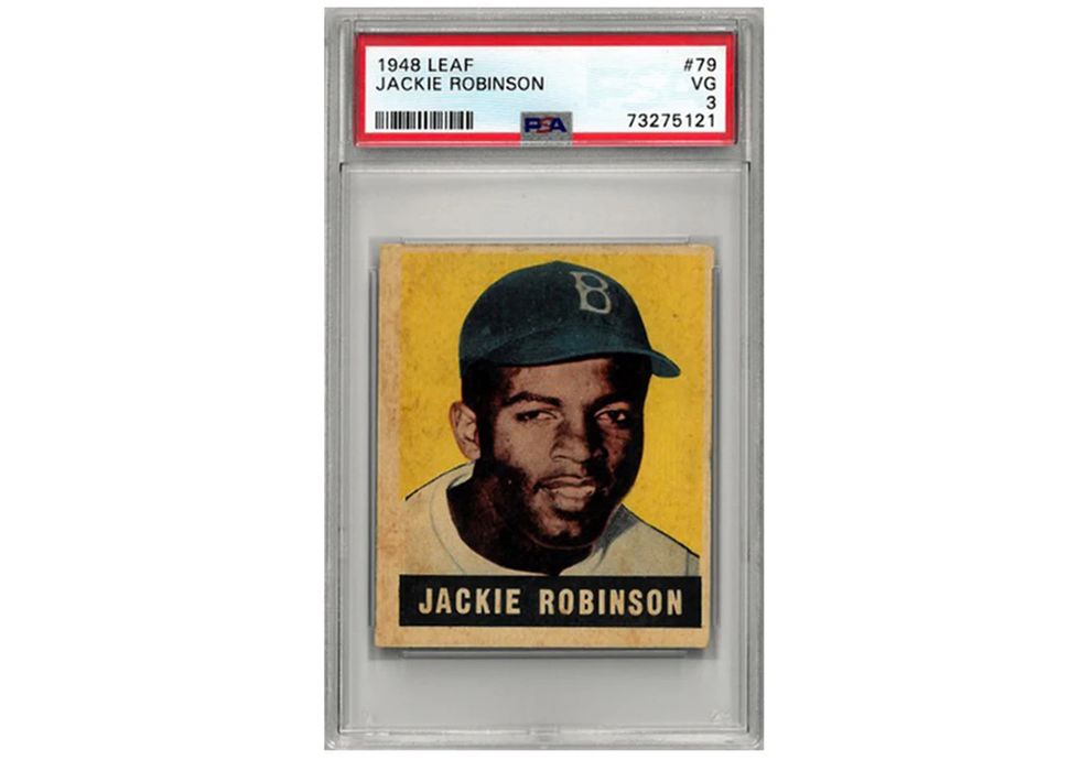 Baseball trading card of Jackie Robinson in a protective case with PSA grading label.